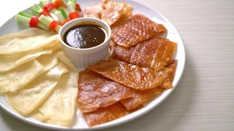 Assorted grilled meat with dipping sauce on a white plate Stock Photos