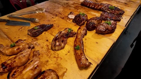 Assorted Grilled Meat Selection on Wooden Board at Thai Street Food Market Видео 335206158
