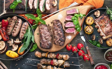 Assorted grilled meat with vegetables Stock Footage 165342561