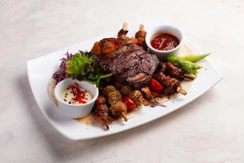 Assorted grilled meats. On a light background. Foto stock