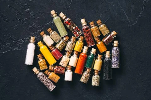Assorted ground spices in bottles top view Stock Photos