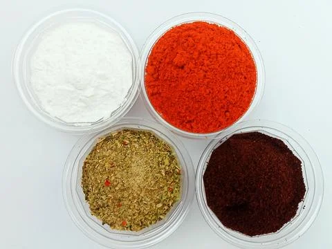 Assorted ground spices in containers on white background Stock Photos