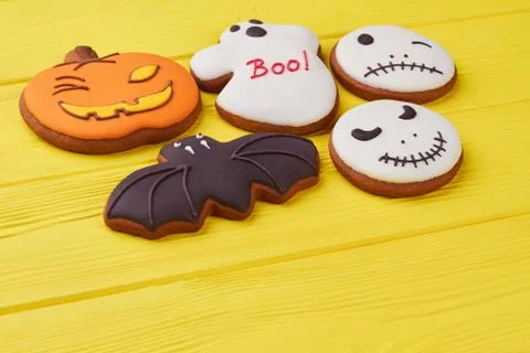 Assorted Halloween biscuits on yellow background. Photos