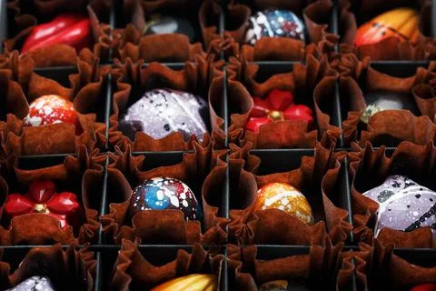 Assorted handmade sweet chocolates in a box Stock Photos