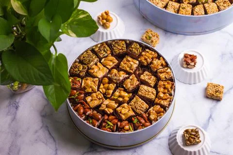 Assorted honey nuts served in a dish isolated on grey background top view of  Foto stock