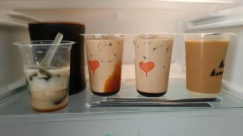 Assorted Iced Coffee Drinks in Refrigerator Stock Photos