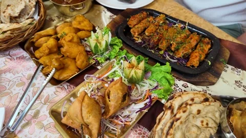 Assorted Indian Cuisine Dishes on Restaurant Table in Bangkok Stock Footage 344616112