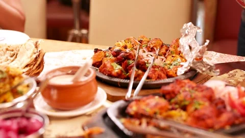 Assorted Indian Cuisine Spread with Chicken Tikka and Naan Bread 動画素材 339122713