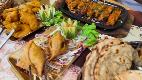 Assorted Indian Cuisine Spread with Curry Naan and Biryani Stock Footage 342698472