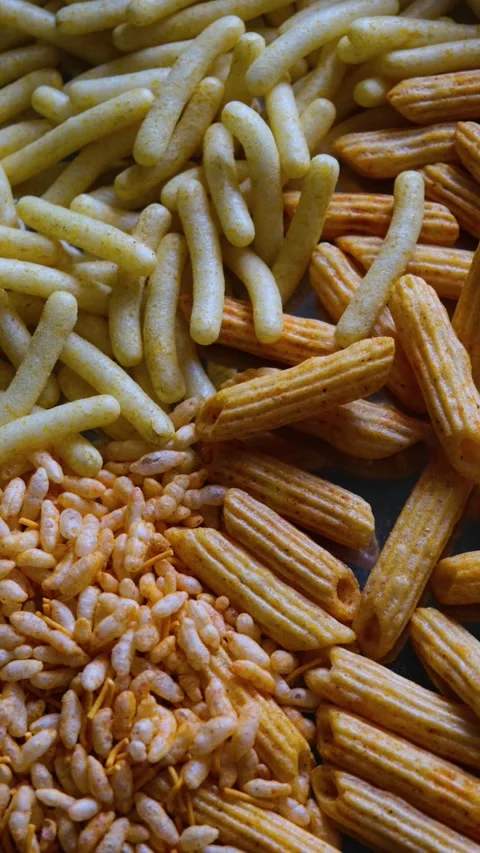 Assorted Indian Snacks Mixture with Corn Puffs and Puffed Rice Stock Footage 331986692