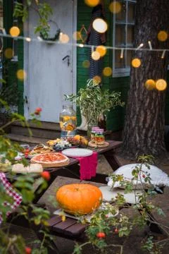 Assorted Italian food table setting in the garden, selective focus Stock Photos