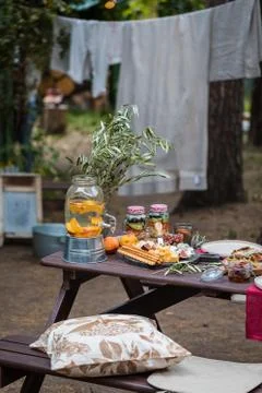 Assorted Italian food table setting in the garden, selective focus Stock Photos