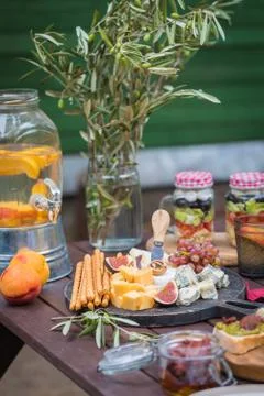 Assorted Italian food table setting in the garden, selective focus Stock Photos