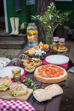 Assorted Italian food table setting in the garden, selective focus Stock Photos