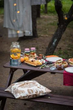 Assorted Italian food table setting in the garden, selective focus Stock Photos
