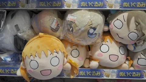 Assorted kawai cuddly soft anime manga toys at the store Stock Footage 126706943