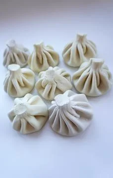 Assorted khinkali arranged on surface. Stock Photos