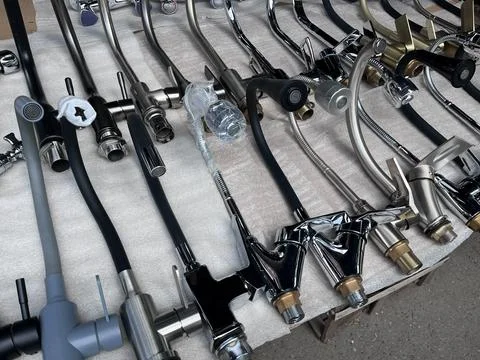 Assorted kitchen sink faucets on display Stock Photos