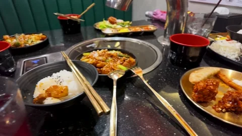 Assorted Korean Fried Chicken and Side Dishes on Restaurant Table Stock Footage 339514861