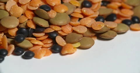 Assorted Lentils Pile Close Up Edge on White Spins Stock Footage 64974402