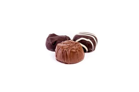 Assorted light and dark chocolates isolated over white background Stock Photos