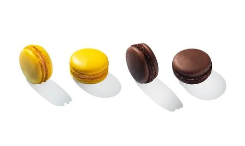 Assorted macarons lemon and chocolate. White background isolated Stock Photos