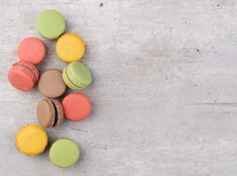 Assorted macarons over rustic background with copy space Fotos Stock