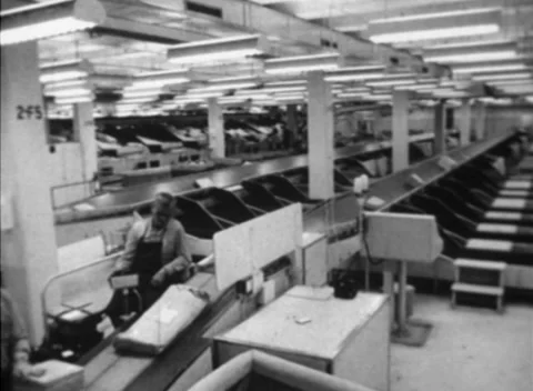 Assorted Mail / Packages on Conveyor Belts at Sorting Centre (1960s) Stock Footage 153457990