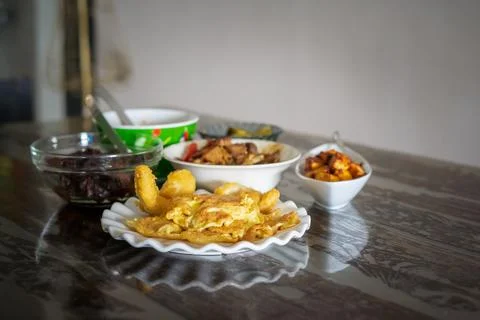 Assorted Malay dishes served on the table. Staple menu for lunch and dinner i Stock Photos