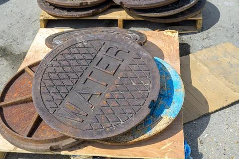 Assorted Manhole Covers on Pallets Stock Photos