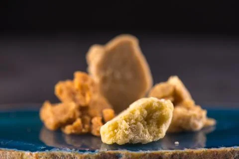 Assorted marijuana extraction concentrate aka wax crumble on dark background Stock Photos
