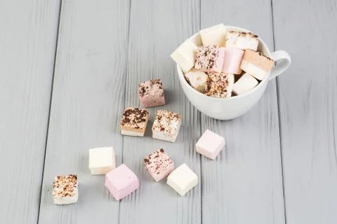 Assorted marshmallow on a gray table Stock Photos
