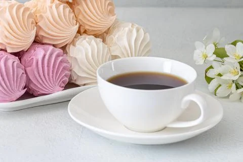 Assorted marshmallows for breakfast with a cup of fragrant coffee Stock Photos