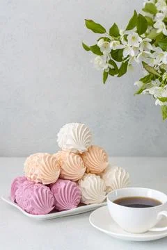Assorted marshmallows for breakfast with a cup of fragrant coffee Stock Photos