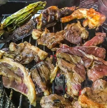 Assorted meat from chicken, pork, beef, fish and vegetable cooked on charcoal Stock Photos