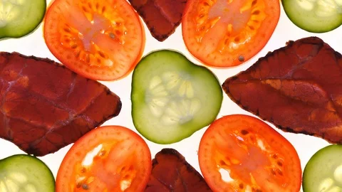 Assorted meat with fresh sliced vegetables rotating on white background in 4K 库存影片 90219210