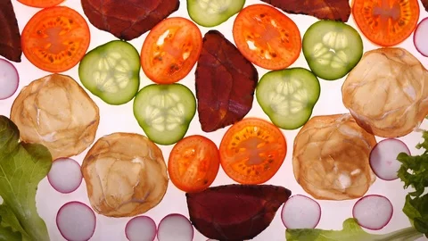 Assorted meat with fresh sliced vegetables rotating on white background 스톡 동영상 90219219