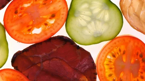 Assorted meat with vegetables rotating on white background in 4K 库存影片 87111808