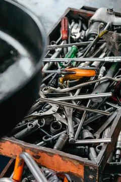 Assorted mechanic tools are ready for use in a full metal toolbox Stock Photos