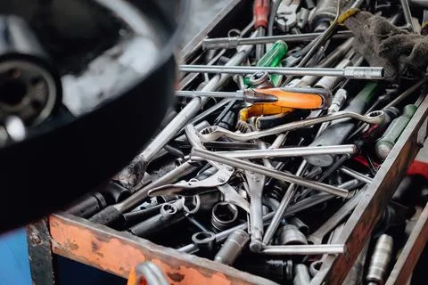Assorted mechanic tools are ready for use in a full metal toolbox Stock Photos