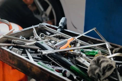 Assorted mechanic tools are ready for use in a full metal toolbox Stock Photos