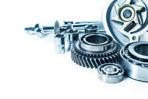 Assorted mechanical components arranged on a light background highlighting Stock Photos