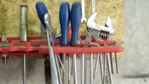 Assorted mechanical instruments in garage stall Vídeos de archivo 128922101
