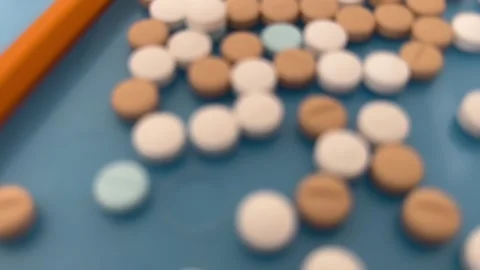 Assorted medicine with a pencil for size comparison Stock Footage 276348858