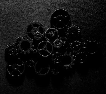 Assorted metal machine gears and components background Stock Photos