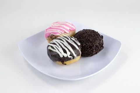 Assorted Mini Donuts with Chocolate and Pink Glaze on White Plate Isolated .. Stock Photos