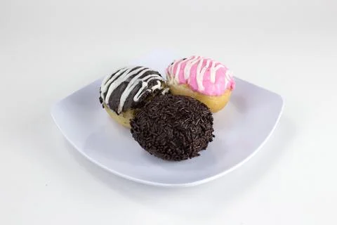 Assorted Mini Donuts with Chocolate and Pink Glaze on White Plate Isolated .. Stock Photos