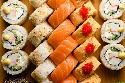Assorted mix of various sushi rolls with tuna, salmon, eel, avocado, vegetables Stock Photos