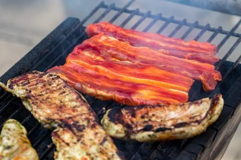 Assorted mixed grill from chicken meat, and pork, sausages  roasting on barbe Stock Photos