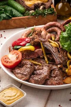 Assorted mixed grilled meat platter Stock Photos